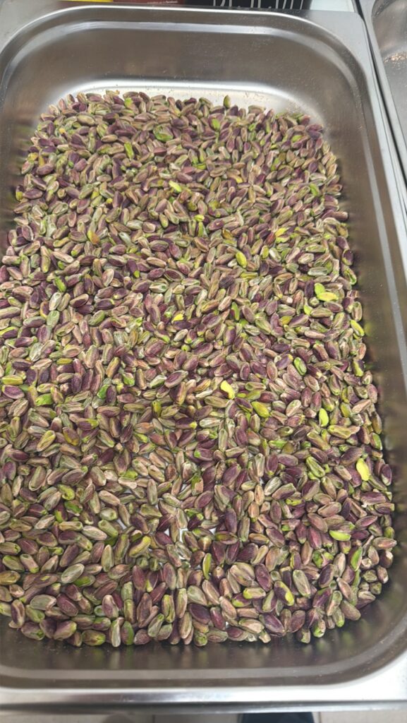 Shelled Aegina pistachios on a tray in the 4 Tastes workshop