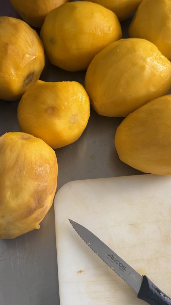 Mangoes peeled by hand in the 4 Tastes workshop