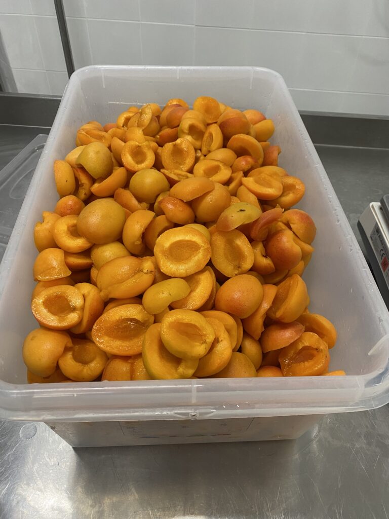 Fresh apricots, halved and pitted, ready to prepare