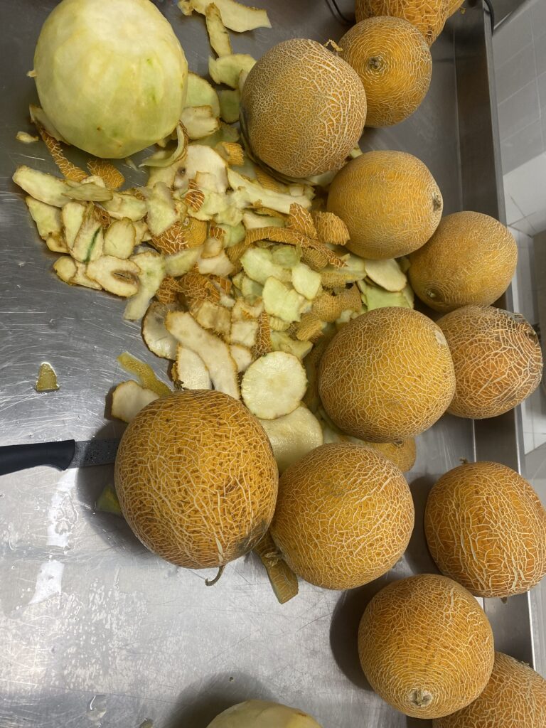 Melons being peeled by hand in the workshop